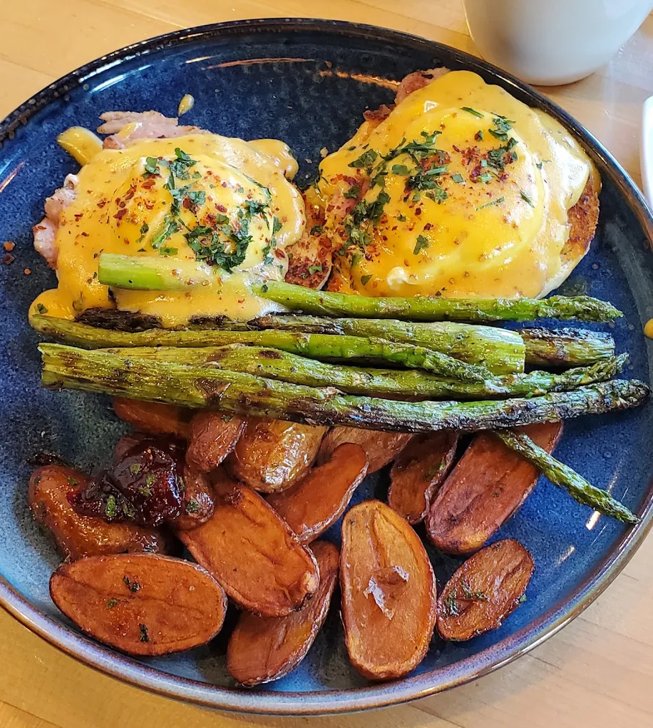 Hand-cut Alberta steak with notable steak butter, served with a tallow-cooked baked potato and spiced local sour cream in Calgary