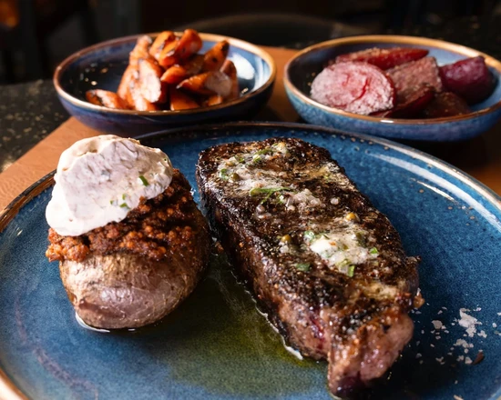 Wood-fired Alberta steak at NOtaBLE - The Steakhouse in northwest Calgary, AB
