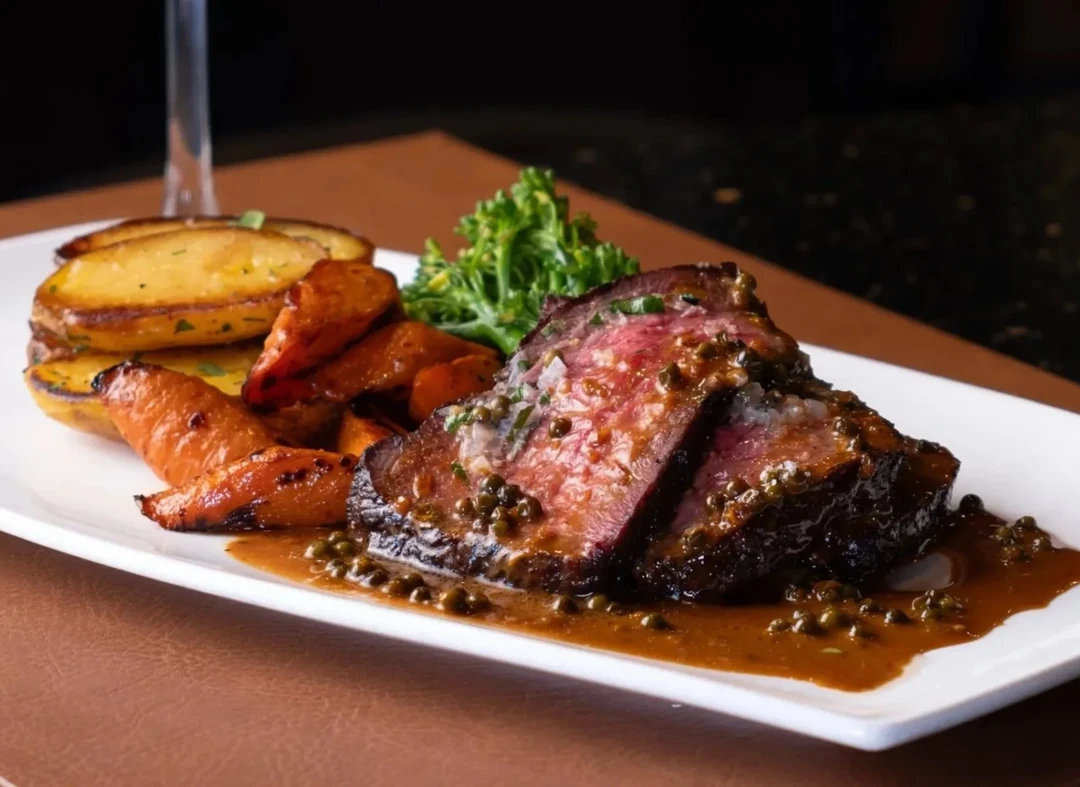 14 oz Canada Prime rib eye grilled over the wood fire at NOtaBLE - The Steakhouse in Montgomery, Calgary
